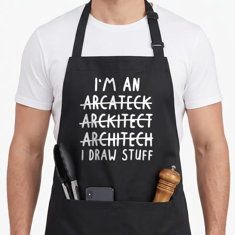Future architect problems apron - White stacked text reading I'm an Arcateck Arckitect Architech I Draw Stuff — shown on a black cotton canvas apron against a white background