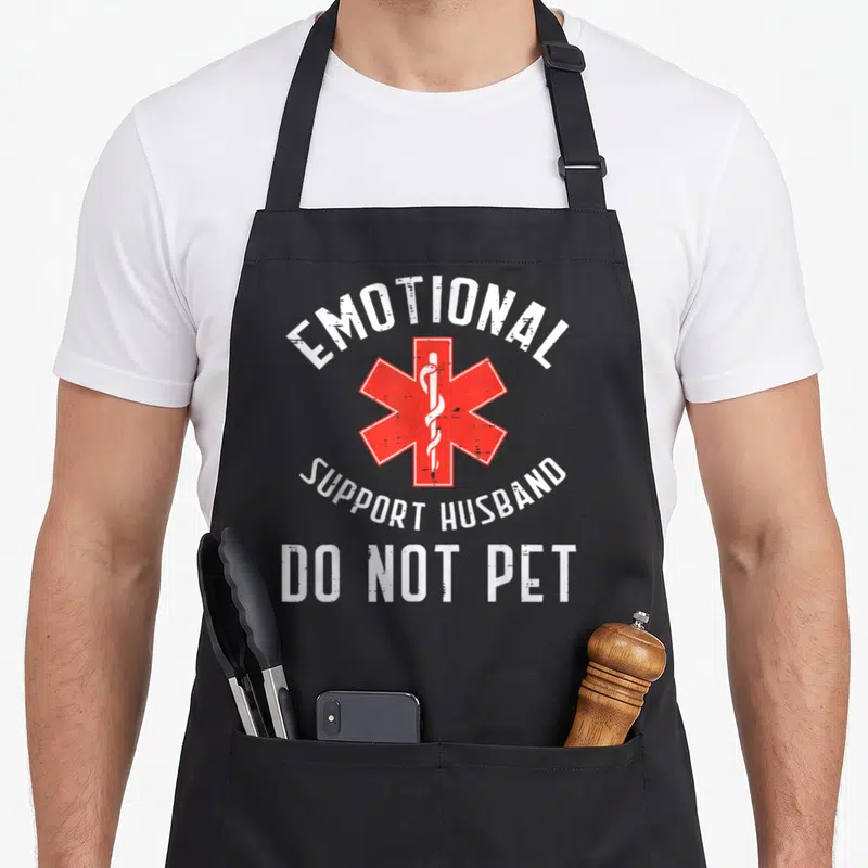 Emotional father day apron - Red Star of Life with emotional support husband do not pet text — shown on a black cotton canvas apron against a white background