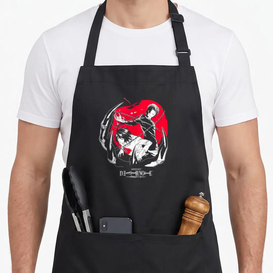 Light apple apron - Two white characters and chains over red apple with Death Note text — shown on a black cotton canvas apron against a white background