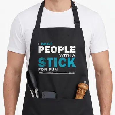 Pool billiards lover apron - Distressed text I BEAT PEOPLE WITH A STICK FOR FUN above horizontal lacrosse stick graphic — shown on a black cotton canvas apron against a white background