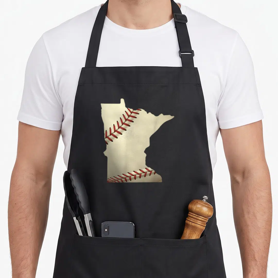 Baseball minnesota apron - Minnesota state map shape filled with red baseball stitching on off-white background — shown on a black cotton canvas apron against a white background