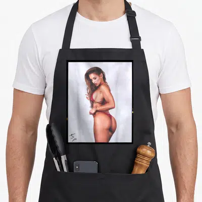 Hot bikini apron - Photo of woman in red bikini framed in black with tan skin and white background — shown on a black cotton canvas apron against a white background