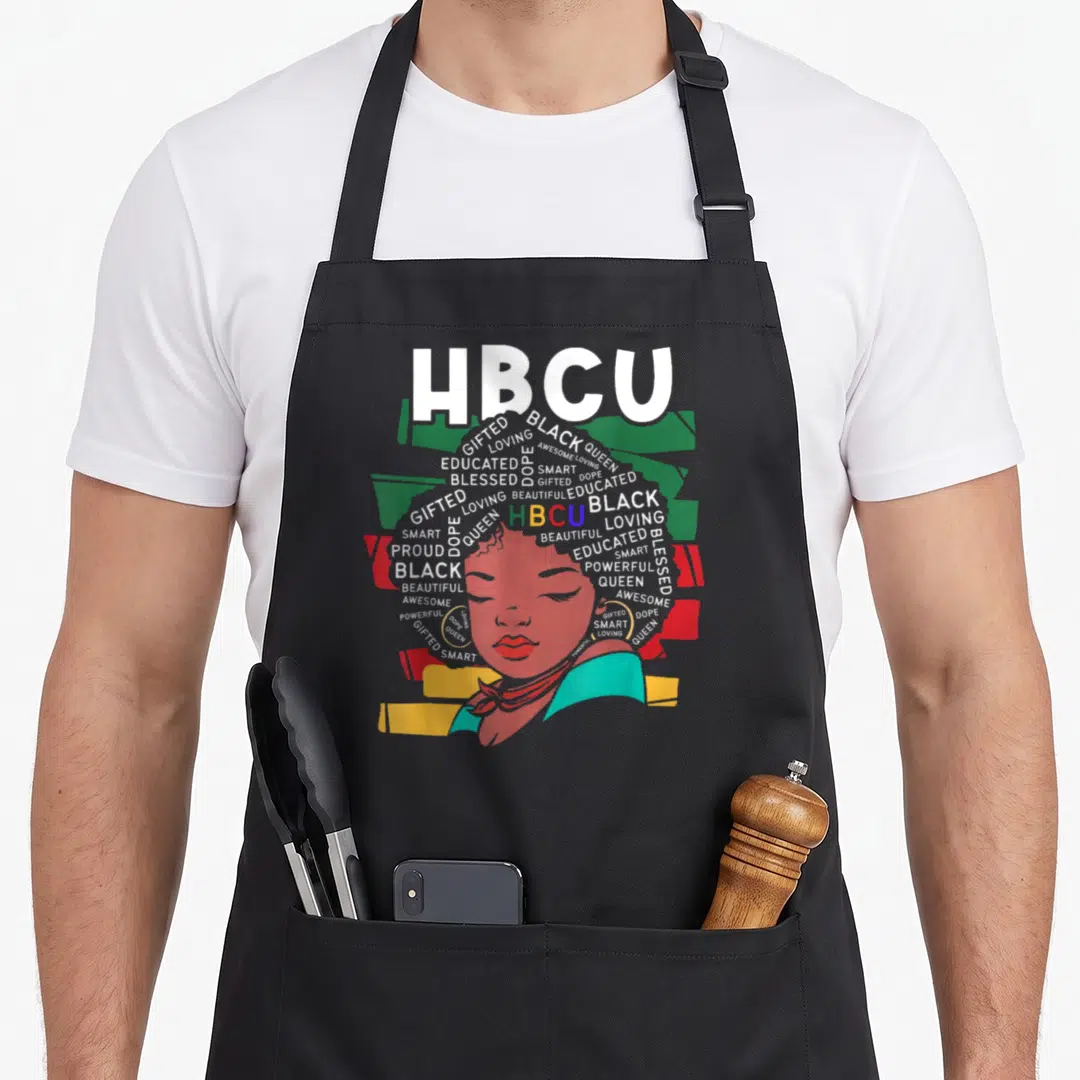 Funny hbcu historical aprons - Typographic woman portrait with HBCU text and affirming words forming hair in white red — shown on a black cotton canvas apron against a white background