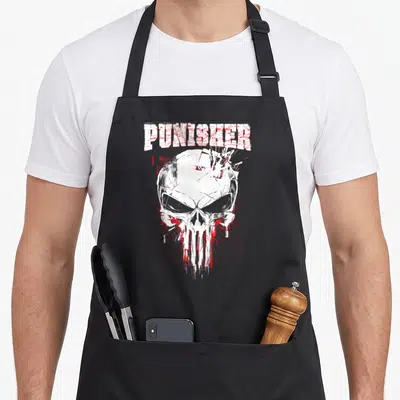 Streaked skull apron - White skull with red target lines and PUNISHER text in distressed style — shown on a black cotton canvas apron against a white background