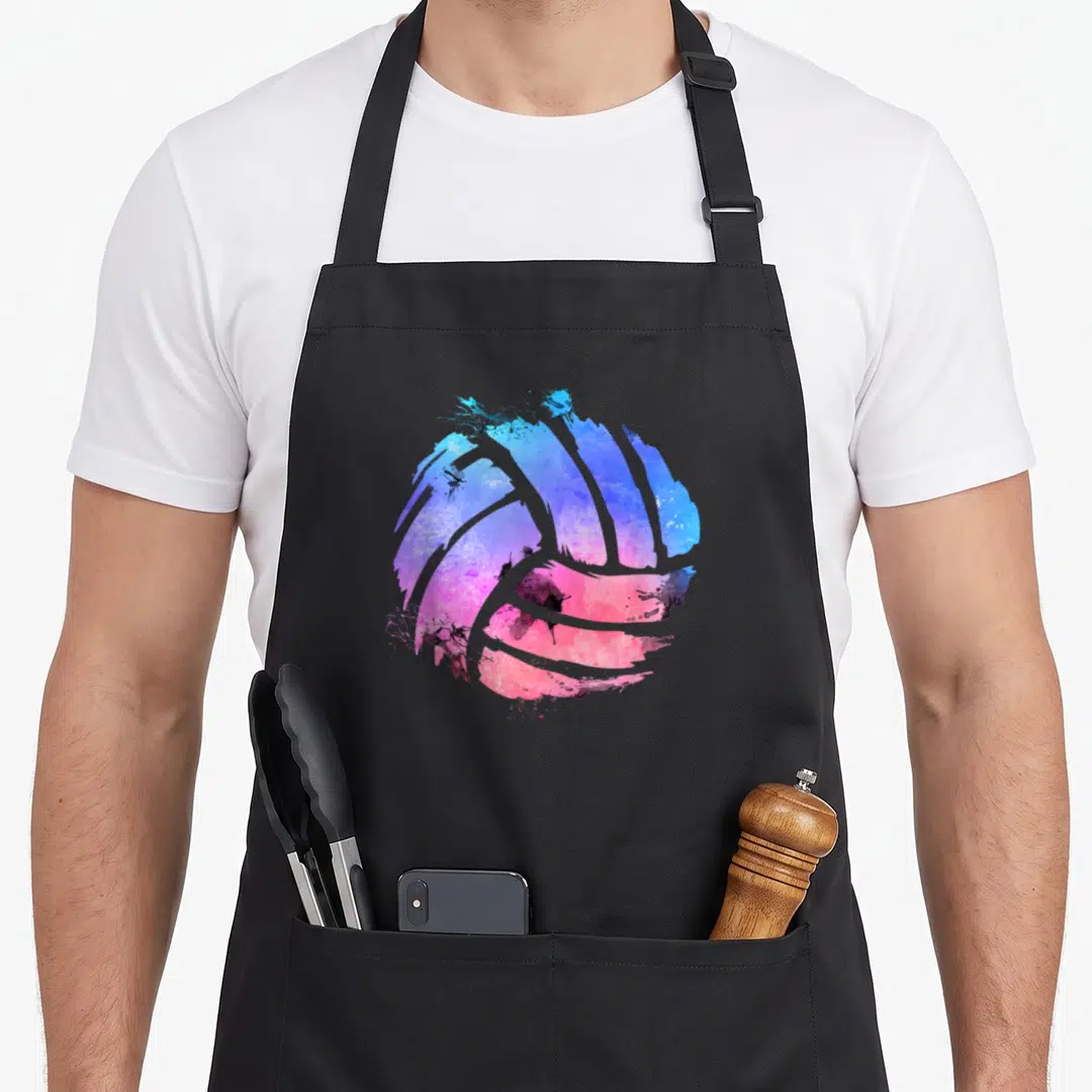 Watercolor volleyball apron - Blue purple and pink watercolor volleyball graphic on black background — shown on a black cotton canvas apron against a white background