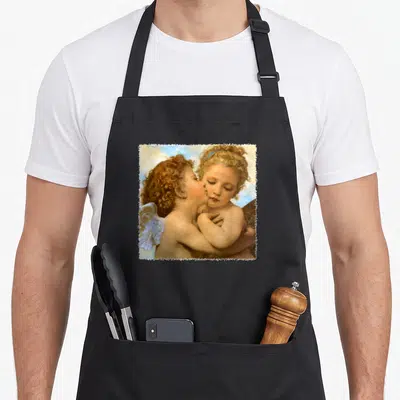 Detail angels in aprons - Two cherubs embracing and kissing inside a distressed white square frame — shown on a black cotton canvas apron against a white background