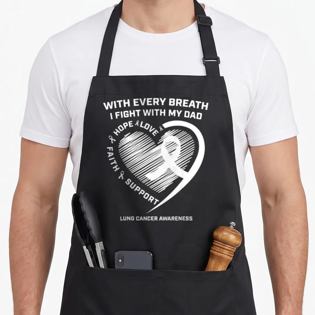 Lung cancer awareness ribbon apron - White heart with ribbon and text With Every Breath I Fight With My Dad Lung Cancer — shown on a black cotton canvas apron against a white background