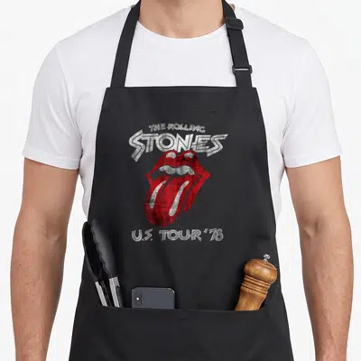 Tour rolling stones apron - Red mouth logo with arched white text reading THE ROLLING STONES U.S. TOUR '78 — shown on a black cotton canvas apron against a white background