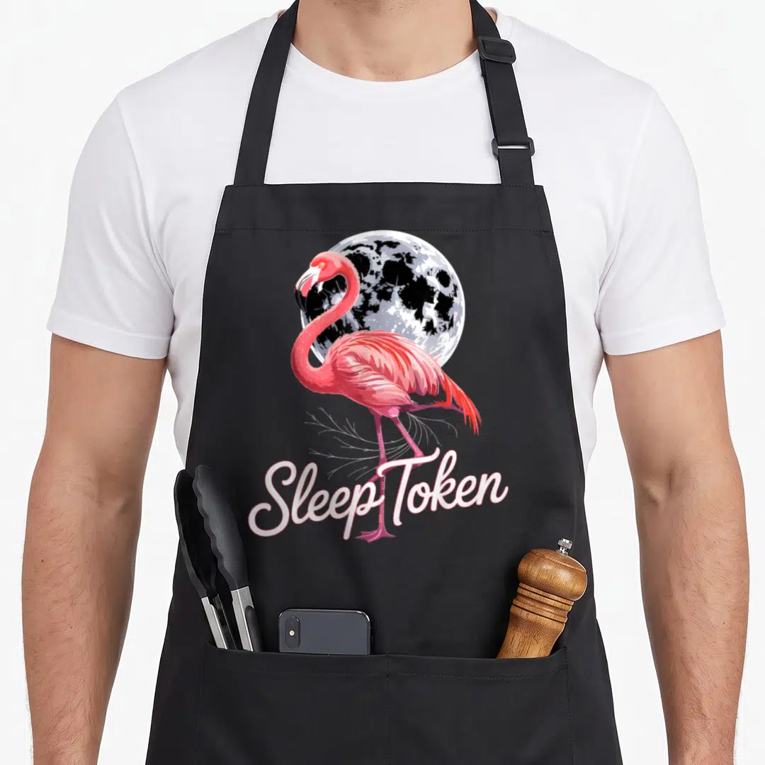 Sleep flamingo apron - Realistic pink flamingo standing in front of a moon with Sleep Token script text below — shown on a black cotton canvas apron against a white background