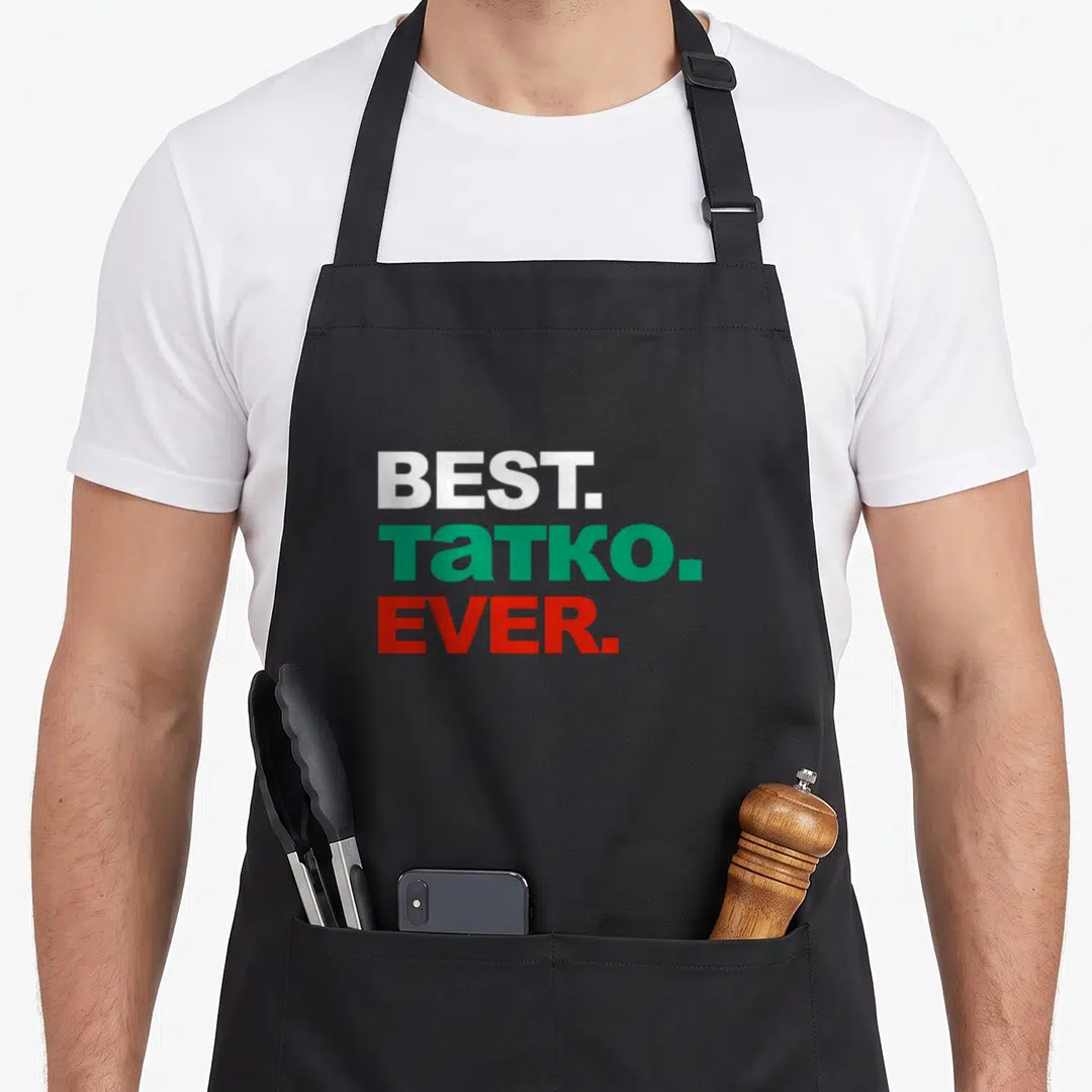 Tatko father day apron - Stacked BEST TATKO EVER text in white green and red block letters — shown on a black cotton canvas apron against a white background