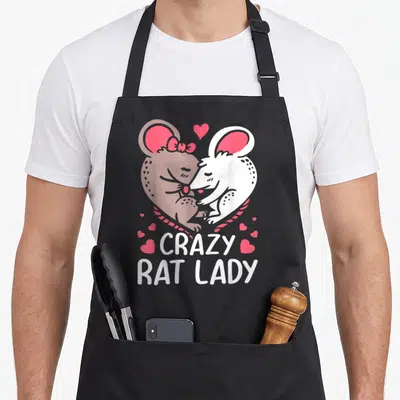 Vintage owner pet apron - Two cartoon rats in pink heart with CRAZY RAT LADY text surrounded by small hearts — shown on a black cotton canvas apron against a white background
