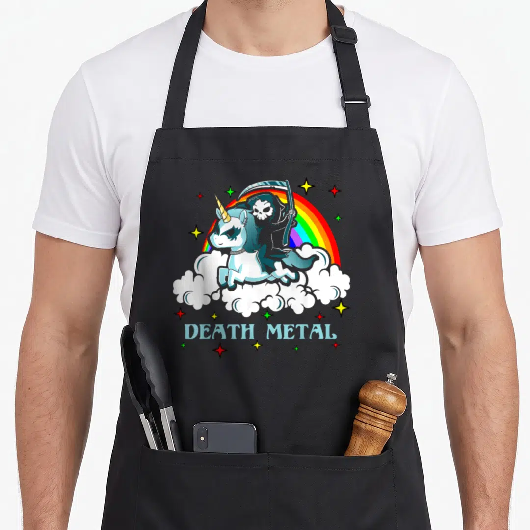Death unicorn apron - Cartoon Grim Reaper riding blue unicorn over clouds with DEATH METAL text and rainbow — shown on a black cotton canvas apron against a white background