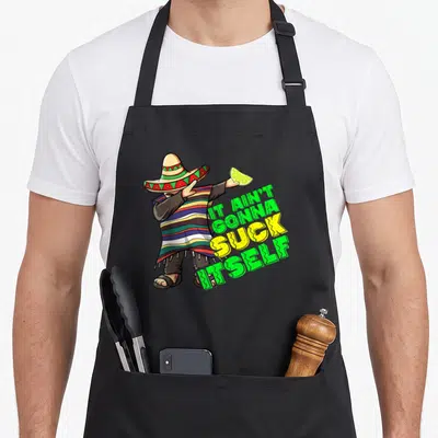 Cinco mayo apron - Cartoon man in striped poncho holding lime next to stacked green and yellow text — shown on a black cotton canvas apron against a white background