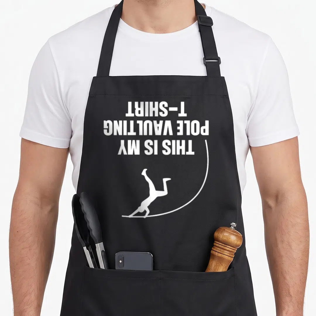 Vaulter track apron - Upside down white text reading This Is My Pole Vaulting T-Shirt above a minimalist pole vaulter — shown on a black cotton canvas apron against a white background