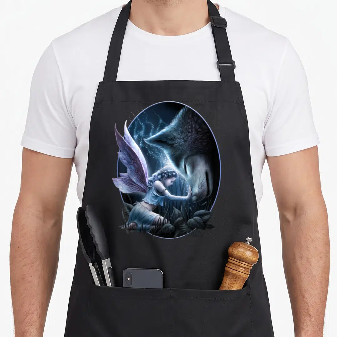 Spiral fairy apron - Fairy kneeling touching wolf nose inside oval with blue purple grey leaves and sparkles — shown on a black cotton canvas apron against a white background