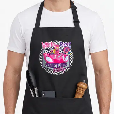 Wacky cartoon apron - Penelope Pitstop pink car Wacky Races 5 Pitstop checkered circle — shown on a black cotton canvas apron against a white background