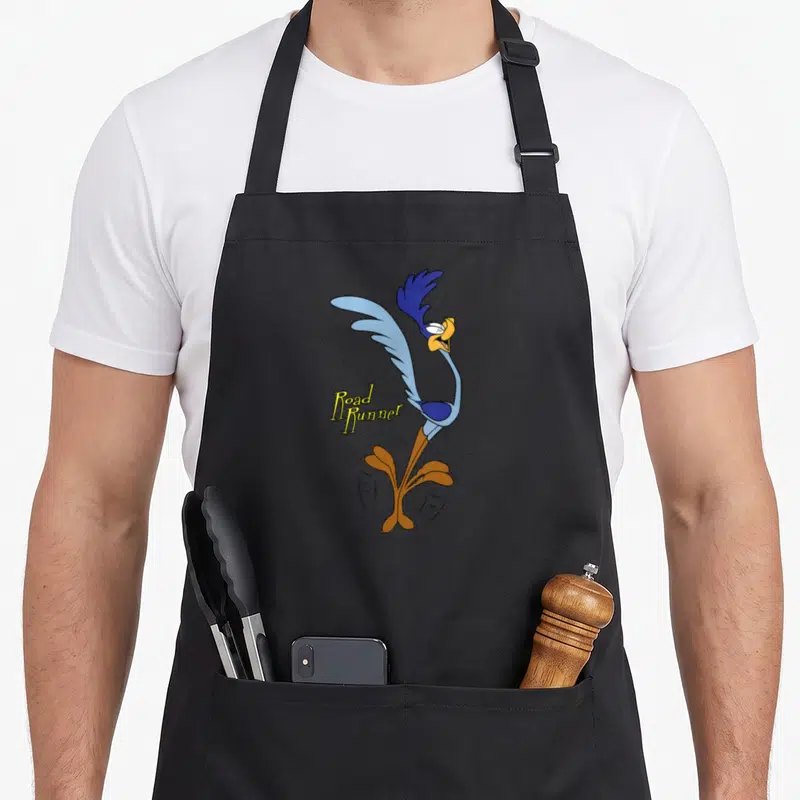 Cute runner road apron - Cartoon Road Runner in blue yellow brown with Road Runner text overlay on left side — shown on a black cotton canvas apron against a white background