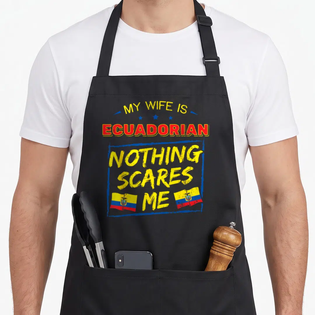 Ecuadorian wife apron - Text My Wife Is Ecuadorian Nothing Scares Me with two flags in yellow blue and red — shown on a black cotton canvas apron against a white background