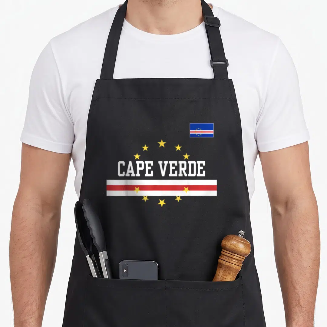 Funny flag cape verde apron - CAPE VERDE text with arch of stars and red white striped bar in blue white red yellow — shown on a black cotton canvas apron against a white background