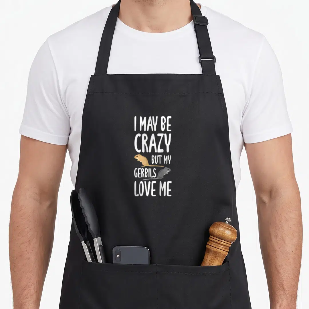 May baseball apron - Stacked white text reading I may be crazy but my gerbils love me with two cartoon gerbils in brown — shown on a black cotton canvas apron against a white background