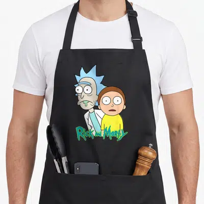 Stunned general apron - Rick and Morty cartoon print with blue yellow green and white colors and two front pockets — shown on a black cotton canvas apron against a white background