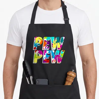 Paintballer tactical apron - Stacked PEW PEW text filled with yellow magenta cyan orange and purple paint splatters — shown on a black cotton canvas apron against a white background