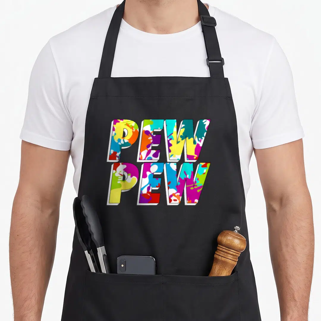 Paintballer tactical apron - Stacked PEW PEW text filled with yellow magenta cyan orange and purple paint splatters — shown on a black cotton canvas apron against a white background