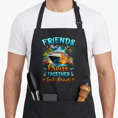 Together friends apron - Cruise ship between palm trees with FRIENDS that Cruise TOGETHER Last Forever text and anchors — shown on a black cotton canvas apron against a white background