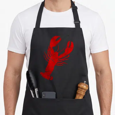 Vintage lobster apron - Red distressed lobster illustration with cracked texture on plain background — shown on a black cotton canvas apron against a white background