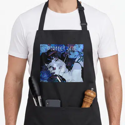 Perfect anime apron - Anime woman face surrounded by blue and purple flowers with PERFECT BLUE text — shown on a black cotton canvas apron against a white background