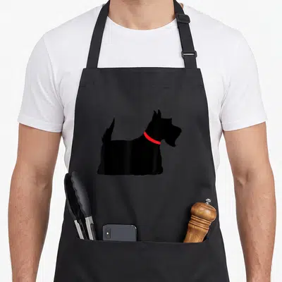 Collar dog apron - Black Scottish Terrier silhouette wearing a red collar — shown on a black cotton canvas apron against a white background