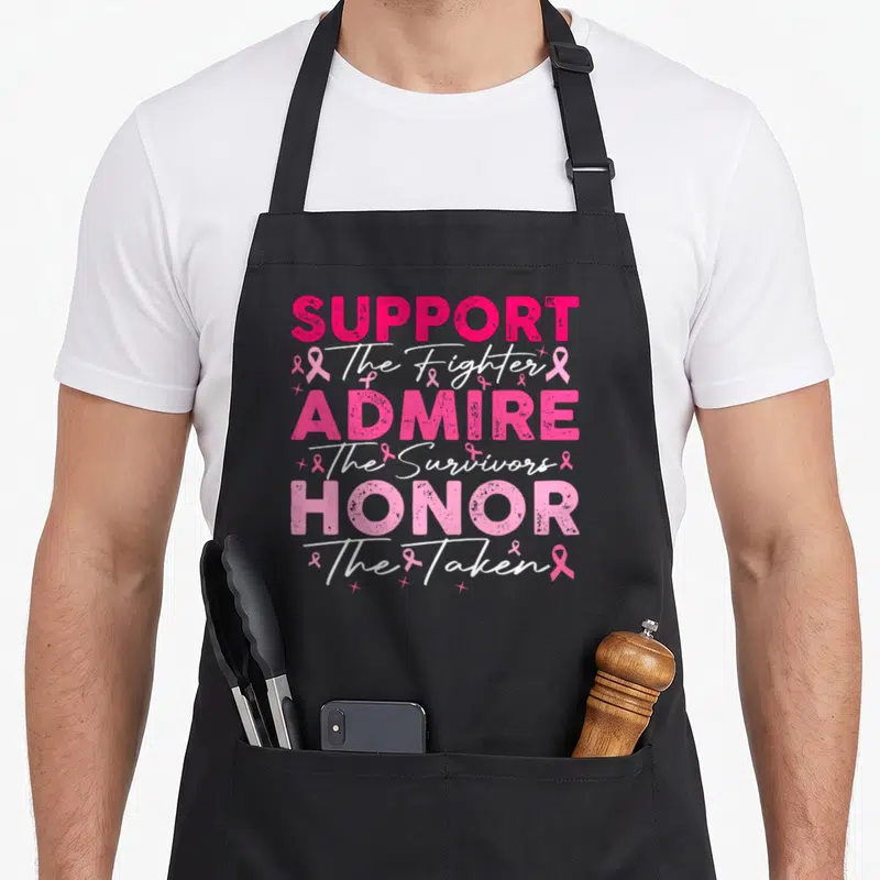 Admire breast cancer awareness aprons - Pink and white stacked text reading Support Fighter Admire Survivors Honor — shown on a black cotton canvas apron against a white background