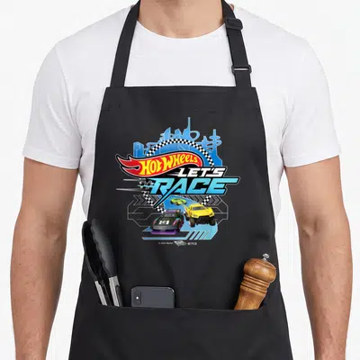 Cityscape car apron - Hot Wheels Let's Race print with two race cars, blue skyline, and checkered flags on black apron — shown on a black cotton canvas apron against a white background