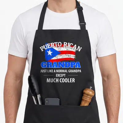 Puerto grandpa apron - Distressed Puerto Rican flag with arched text and blue grandpa lettering — shown on a black cotton canvas apron against a white background