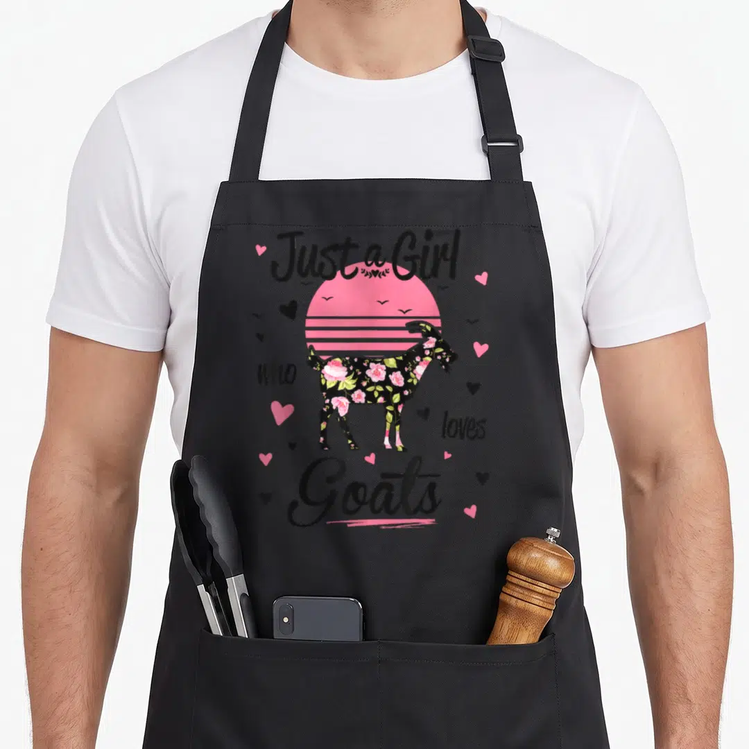 Vintage goat apron - Floral goat silhouette over pink striped sun with hearts and birds — shown on a black cotton canvas apron against a white background