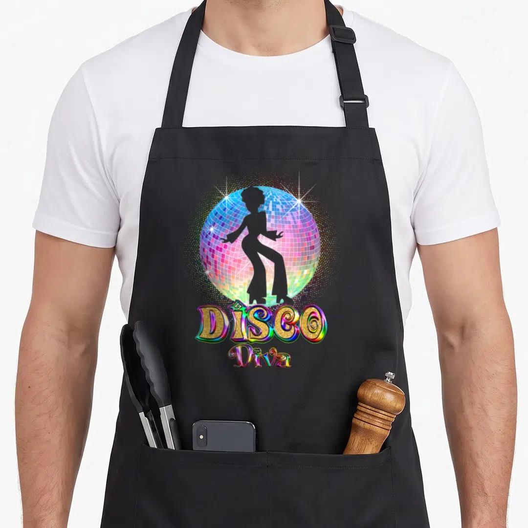 Ball 70s apron - Rainbow disco ball with grey dancer silhouette and glittery DISCO Diva text — shown on a black cotton canvas apron against a white background