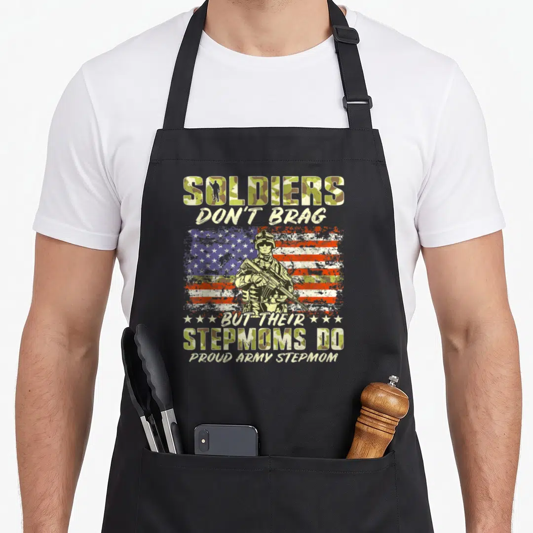 Brag mother's apron - Soldier silhouette before distressed flag with camo text reading Soldiers Don't Brag — shown on a black cotton canvas apron against a white background