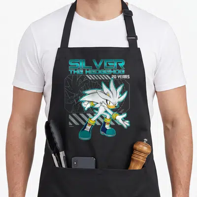 Anniversary distressed apron - Silver the Hedgehog 20 Years text and character art in teal and white — shown on a black cotton canvas apron against a white background