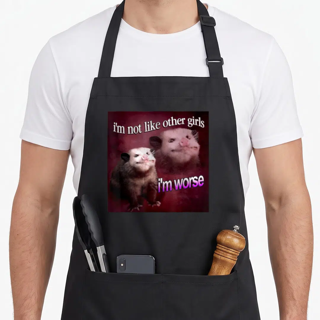 Worse possum apron - Two photo opossums on maroon background with text i'm not like other girls i'm worse — shown on a black cotton canvas apron against a white background