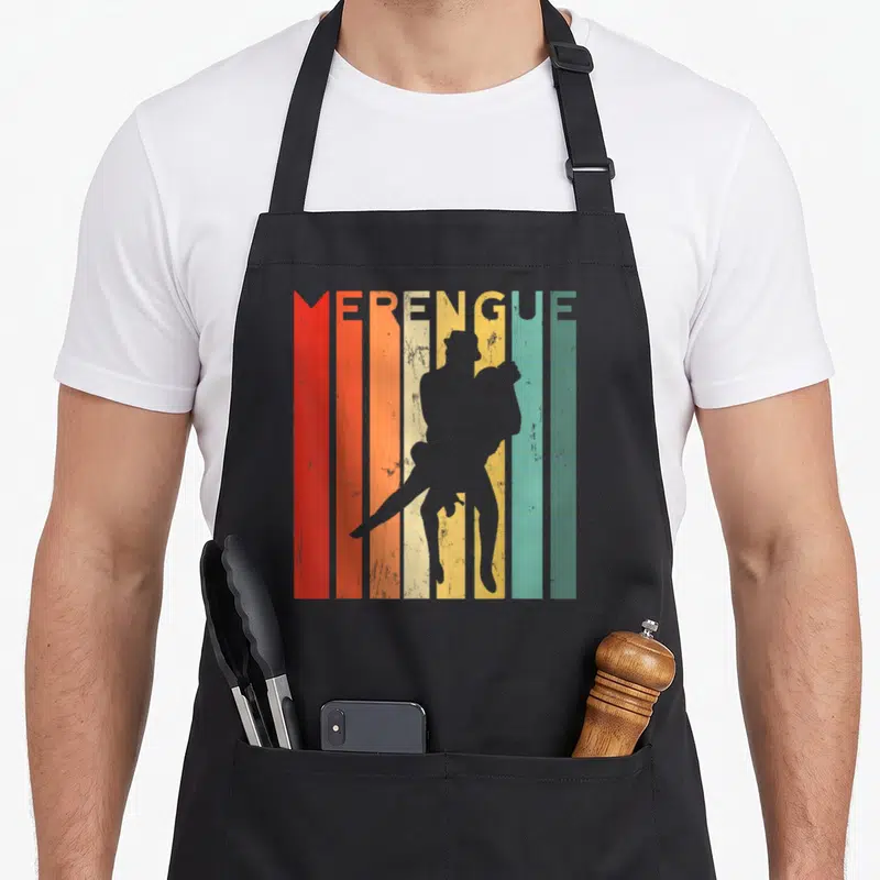 Salsa bachata apron - Retro MERENGUE text above grey dancing couple silhouette on red orange yellow teal stripes — shown on a black cotton canvas apron against a white background