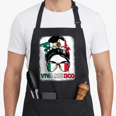Viva mexico apron - Woman with flag bandana and sunglasses displaying Viva Mexico text in distressed green white red — shown on a black cotton canvas apron against a white background