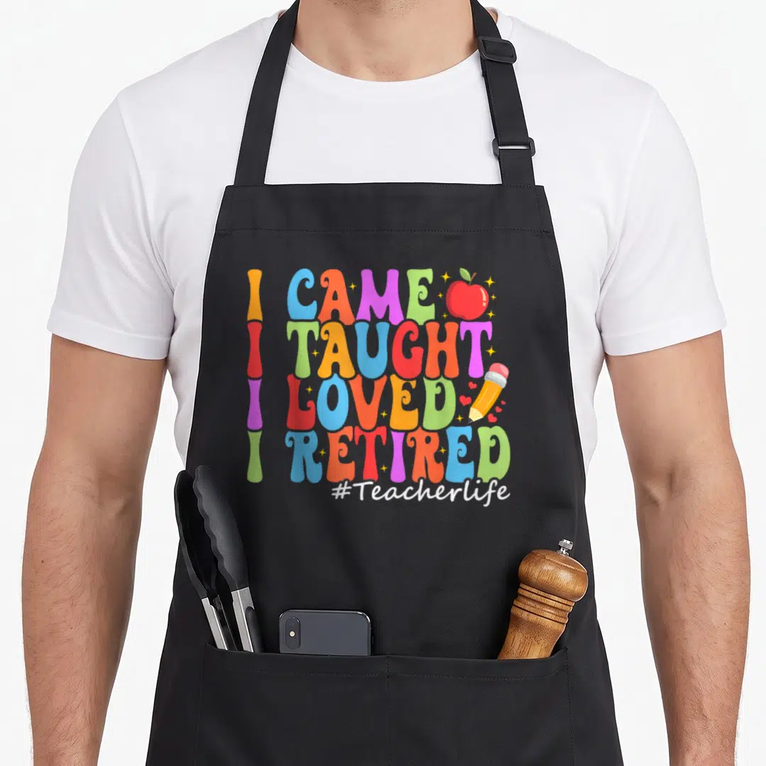 Loved teachers apron - Multi-colored I CAME I TAUGHT I LOVED I RETIRED text with apple pencil and stars — shown on a black cotton canvas apron against a white background