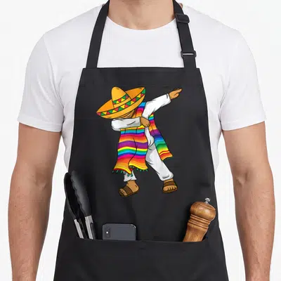 Costume mexican apron - Cartoon man dabbing in sombrero and rainbow striped serape — shown on a black cotton canvas apron against a white background