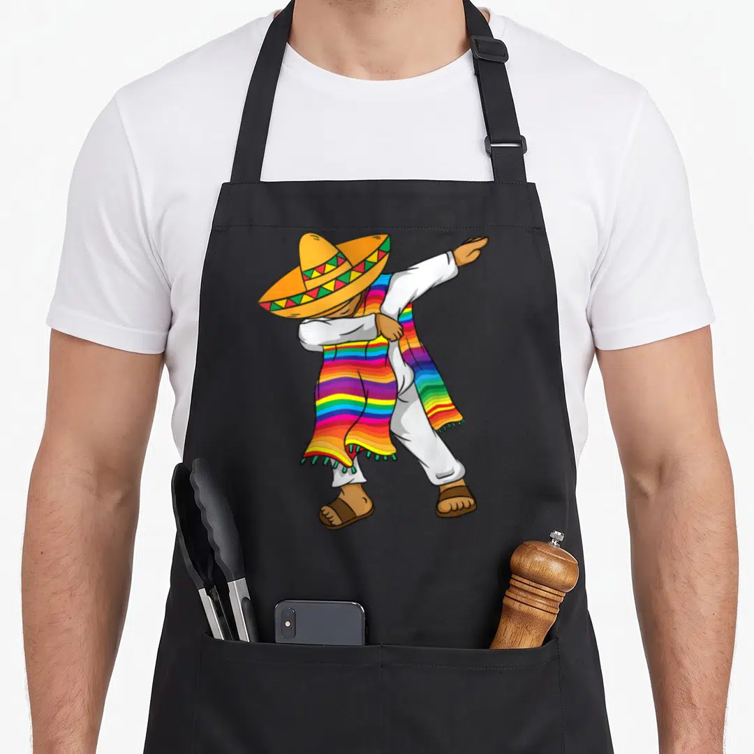 Costume mexican apron - Cartoon man dabbing in sombrero and rainbow striped serape — shown on a black cotton canvas apron against a white background