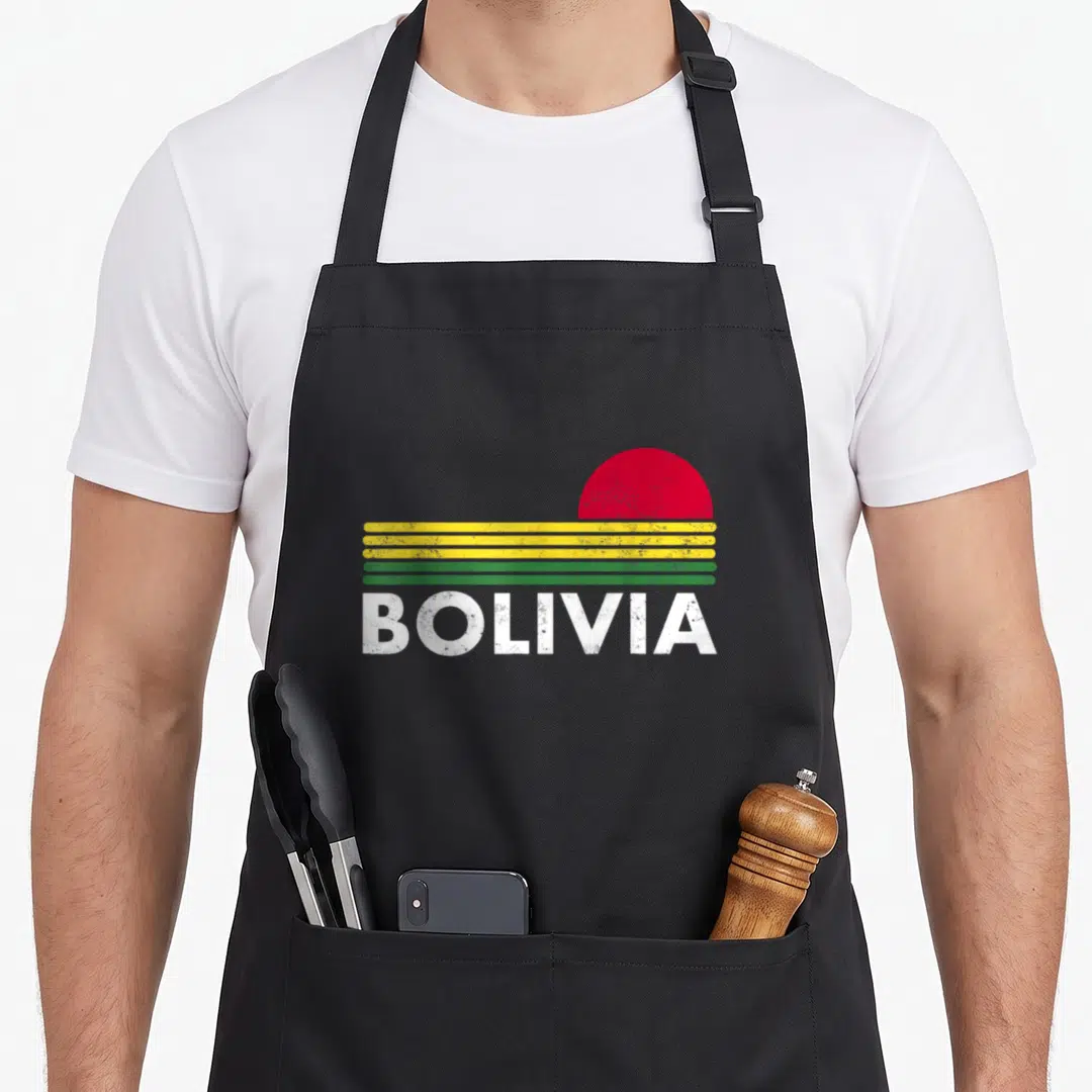 Flag bolivian apron - Retro Bolivia flag design with red semi-circle, yellow green stripes, and distressed white text — shown on a black cotton canvas apron against a white background
