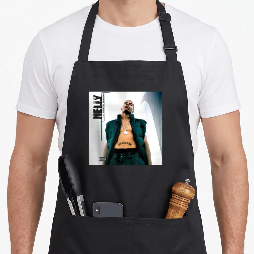 Nelly country apron - Nelly photo with vertical text LUNATIC tattoo and parental advisory label — shown on a black cotton canvas apron against a white background