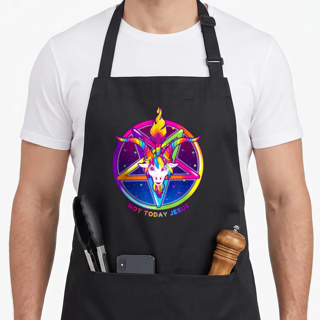 Today rainbow apron - Rainbow goat head in pentagram with flame and arched text Not Today Jesus — shown on a black cotton canvas apron against a white background