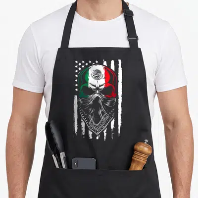 Skull mexican apron - Distressed skull with Mexican flag colors and bandana over American stars and stripes — shown on a black cotton canvas apron against a white background