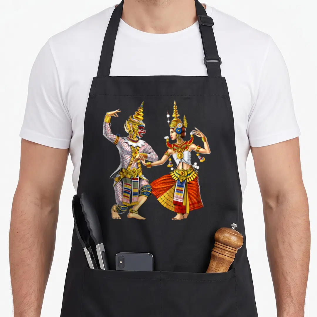 Cambodian traditional apron - Two Thai dancers in gold white and red traditional attire facing each other in dance poses — shown on a black cotton canvas apron against a white background