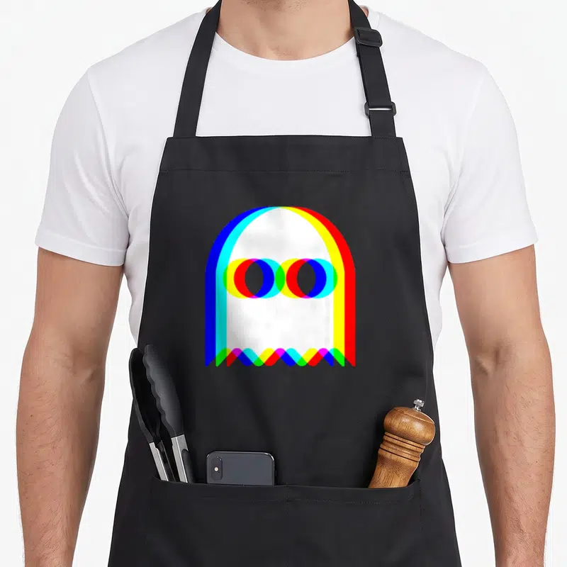 Trippy halloween apron - White ghost outline formed by overlapping blue, cyan, yellow, red, and green color bands — shown on a black cotton canvas apron against a white background